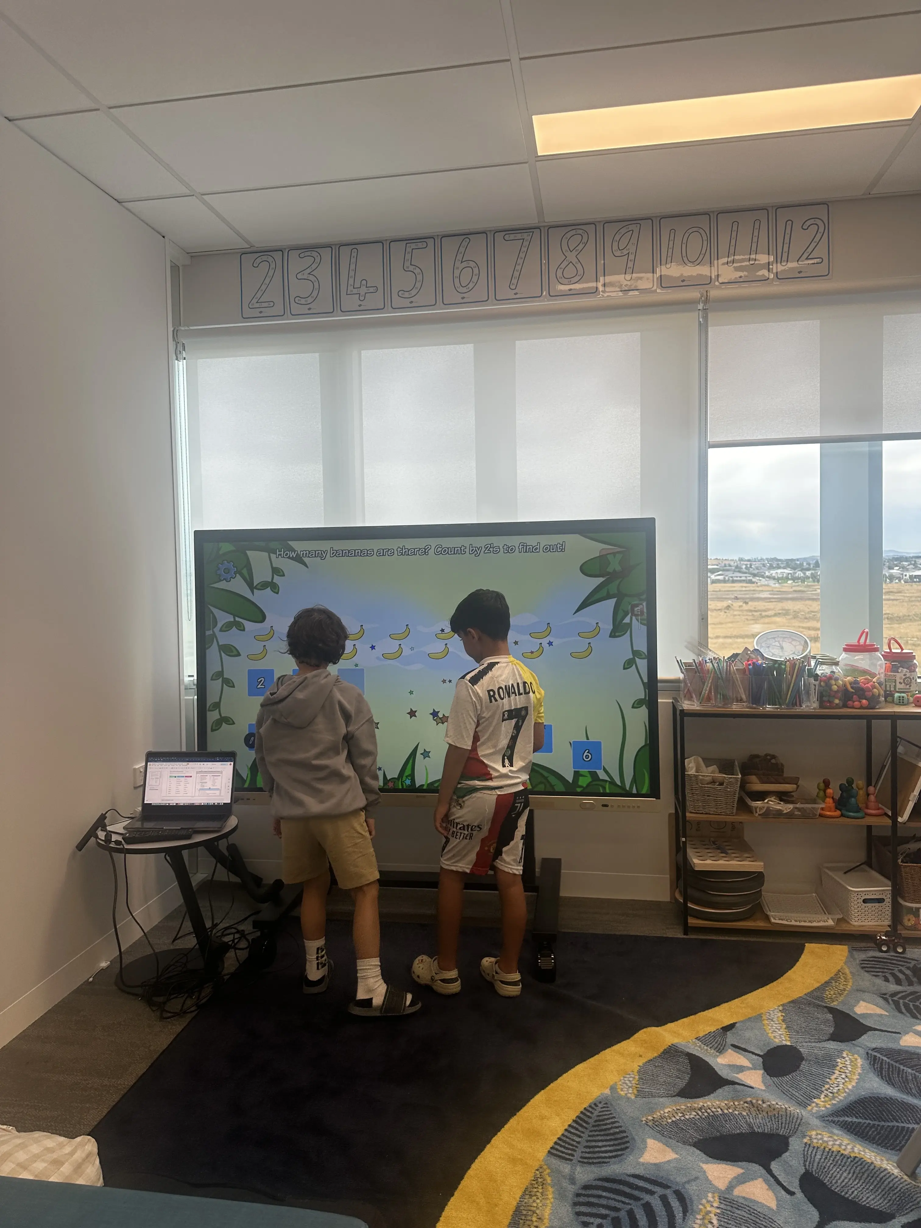 Children learning maths together at New Era Education